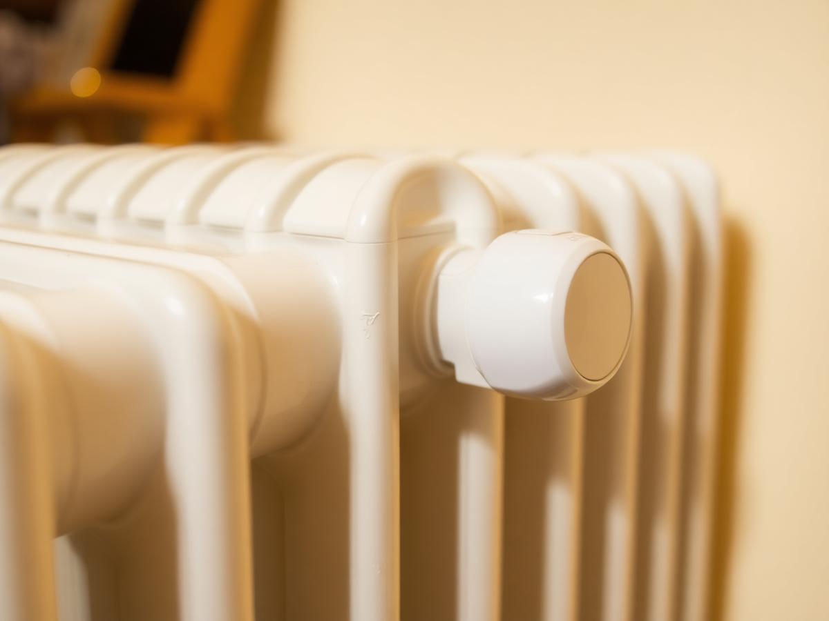 Close-up of a white radiator valve